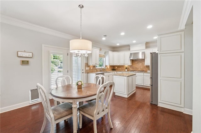 4650 Brighton View Trl, Cumming, GA 30040 - dining space featuring dark wood finished floors, ornamental molding, visible vents, recessed lighting, and baseboards