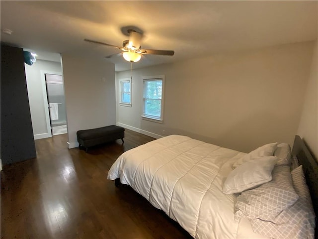 bedroom featuring baseboards, dark wood-style flooring, and ceiling fan