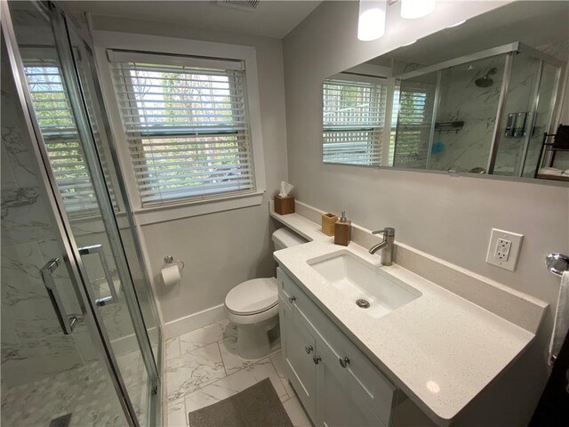 bathroom with a marble finish shower, baseboards, toilet, marble finish floor, and vanity