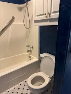 bathroom featuring  shower combination and toilet