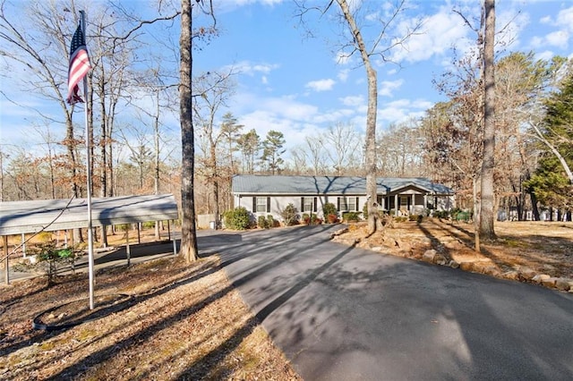 view of front of property featuring a carport