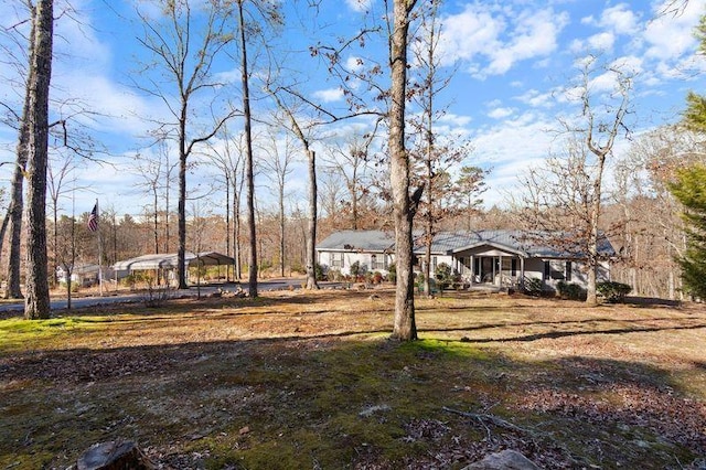 view of yard featuring a carport