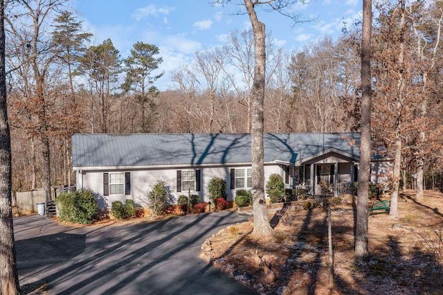 ranch-style home featuring covered porch