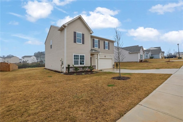 view of front of house featuring a garage and a front lawn