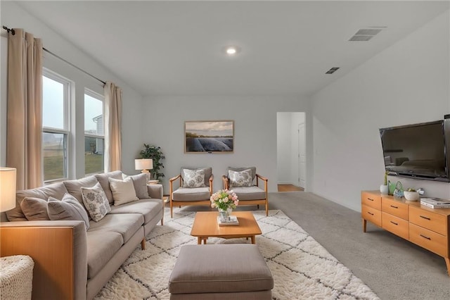 living room featuring light carpet