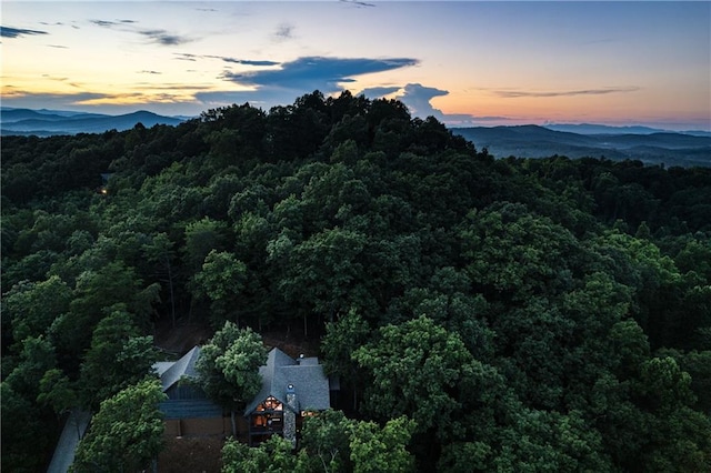 aerial view at dusk featuring a mountain view