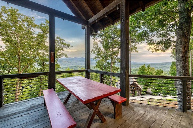 deck at dusk with a mountain view