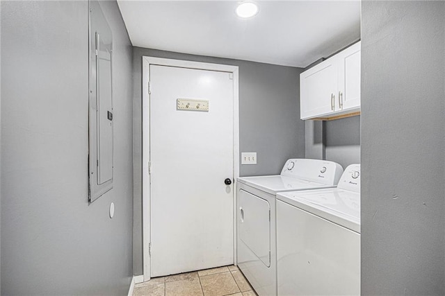 82 Twiggs Cor, Peachtree City, GA 30269 - laundry area featuring washing machine and clothes dryer, cabinet space, light tile patterned flooring, and baseboards