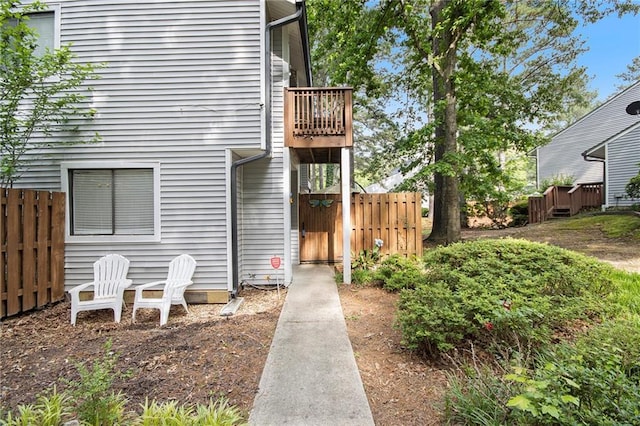 82 Twiggs Cor, Peachtree City, GA 30269 - view of exterior entry featuring a balcony