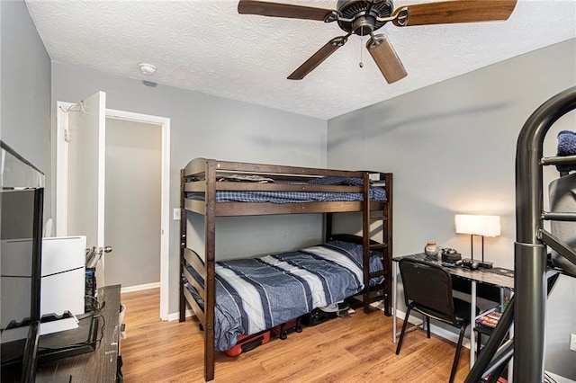 82 Twiggs Cor, Peachtree City, GA 30269 - bedroom featuring wood finished floors, a textured ceiling, and ceiling fan