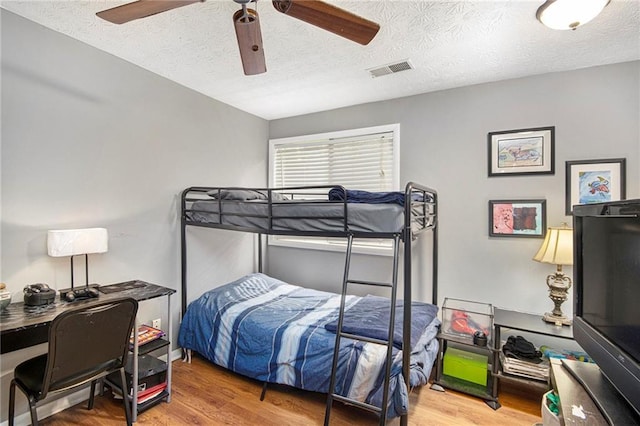 82 Twiggs Cor, Peachtree City, GA 30269 - bedroom featuring a textured ceiling, wood finished floors, and a ceiling fan