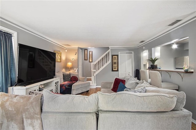 82 Twiggs Cor, Peachtree City, GA 30269 - living room featuring wood finished floors, stairway, crown molding, and baseboards