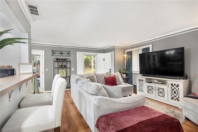 82 Twiggs Cor, Peachtree City, GA 30269 - living area with wood finished floors, a textured ceiling, and ornamental molding