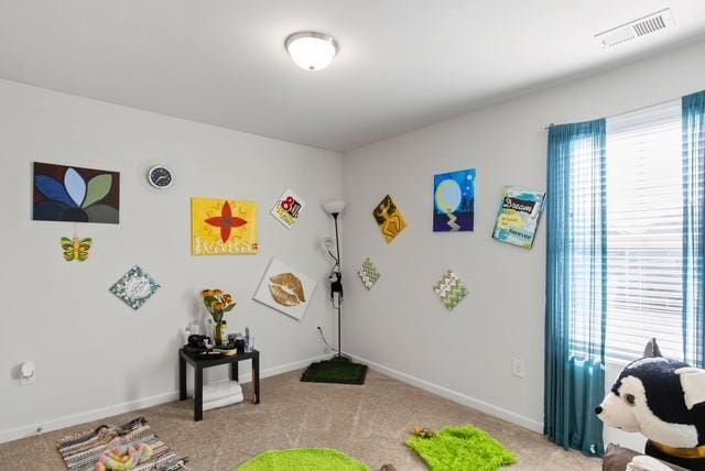 playroom featuring light carpet