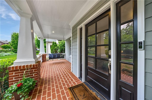 view of patio featuring a porch