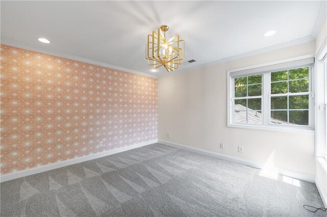 carpeted empty room featuring recessed lighting, a notable chandelier, baseboards, ornamental molding, and wallpapered walls