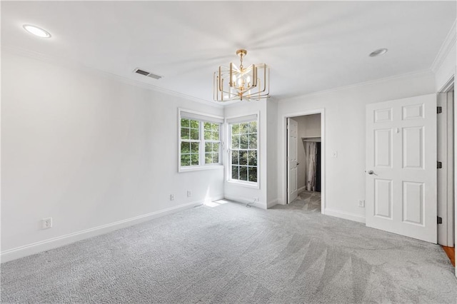 unfurnished bedroom featuring visible vents, carpet floors, an inviting chandelier, baseboards, and ornamental molding