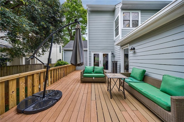 wooden terrace with an outdoor hangout area