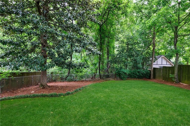 view of yard with a fenced backyard