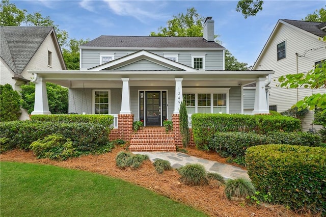 1349 Middlesex Ave NE, Atlanta, GA 30306 - view of front of property with covered porch, a chimney, and brick siding