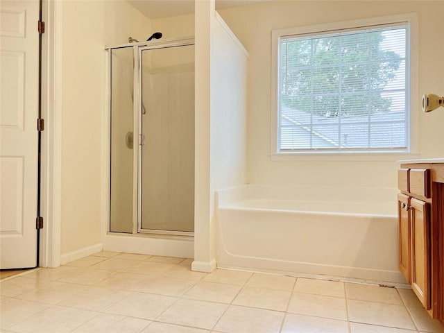 bathroom with tile patterned floors, vanity, and plus walk in shower