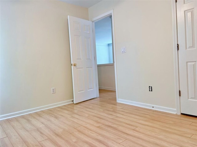 unfurnished room with light hardwood / wood-style floors