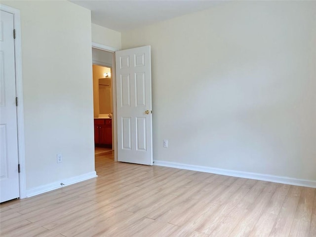 unfurnished room featuring light hardwood / wood-style floors