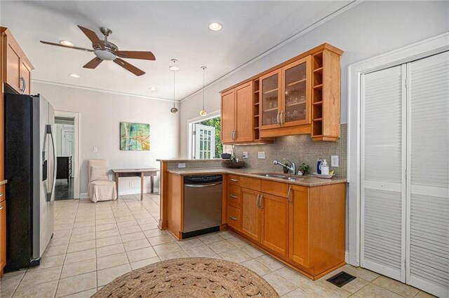 kitchen featuring tasteful backsplash, appliances with stainless steel finishes, light countertops, open shelves, and a sink