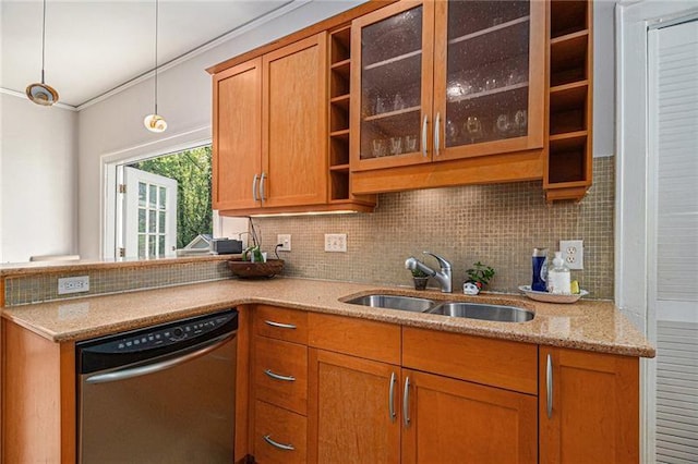 kitchen with tasteful backsplash, brown cabinetry, a sink, and stainless steel dishwasher