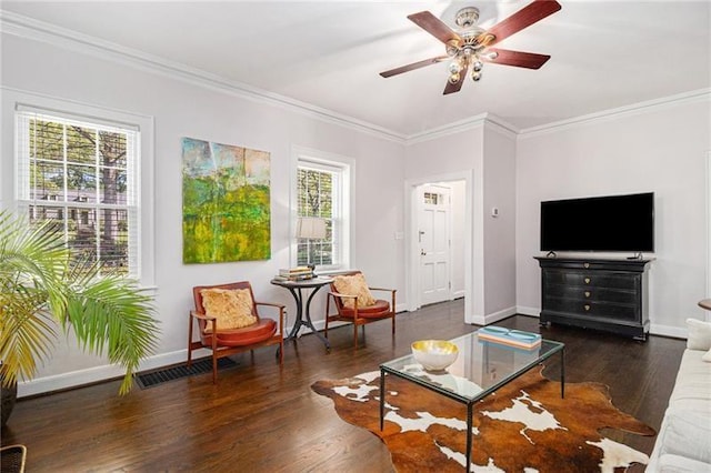 living area featuring baseboards and wood finished floors