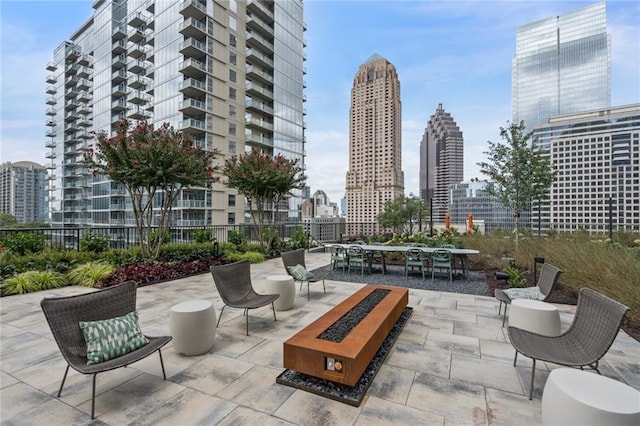 1080 Peachtree St NE Unit 1402, Atlanta, GA 30309 - view of patio / terrace with a city view and outdoor dining area