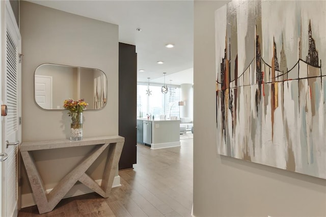 1080 Peachtree St NE Unit 1402, Atlanta, GA 30309 - hall featuring wood finished floors, recessed lighting, and baseboards