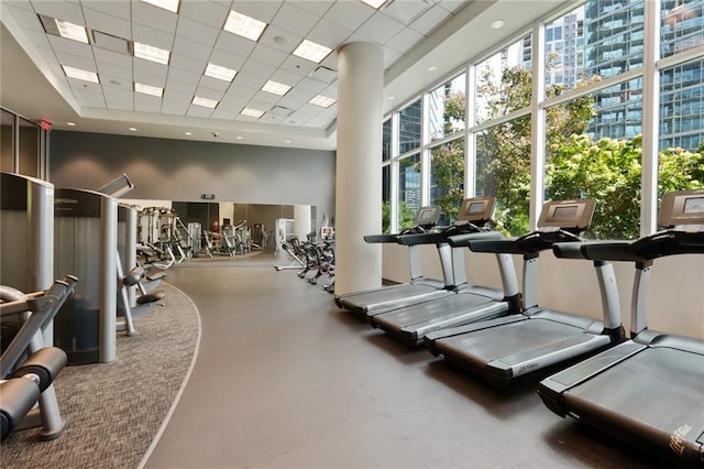 1080 Peachtree St NE Unit 1402, Atlanta, GA 30309 - workout area featuring healthy amount of natural light, a paneled ceiling, a towering ceiling, and a raised ceiling