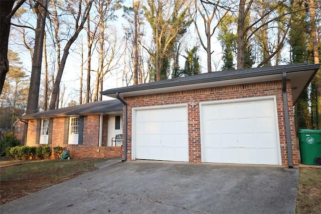 garage featuring driveway