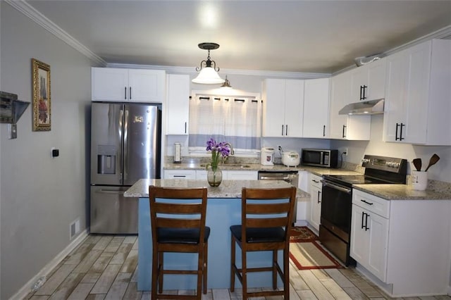 kitchen with under cabinet range hood, appliances with stainless steel finishes, wood tiled floor, and a sink