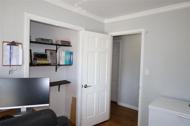 interior space featuring baseboards, wood finished floors, and ornamental molding