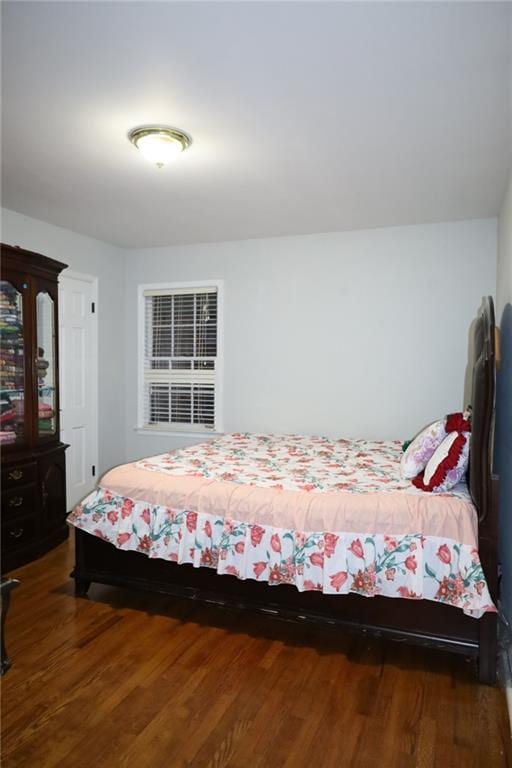 bedroom with wood finished floors