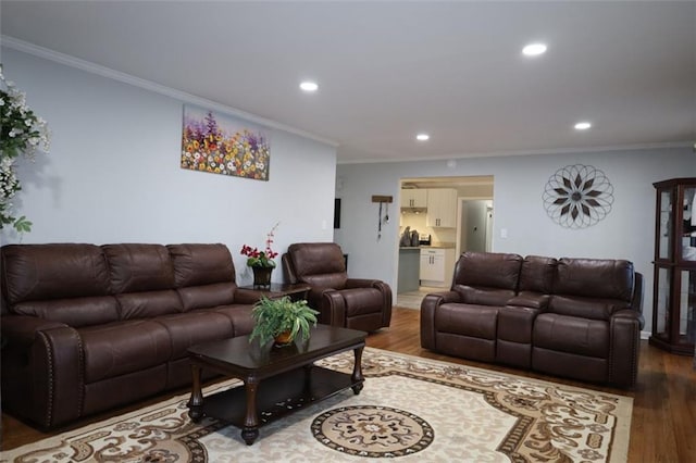 living room featuring recessed lighting, wood finished floors, and ornamental molding