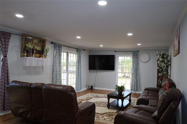 living area featuring recessed lighting, dark wood-style flooring, and ornamental molding