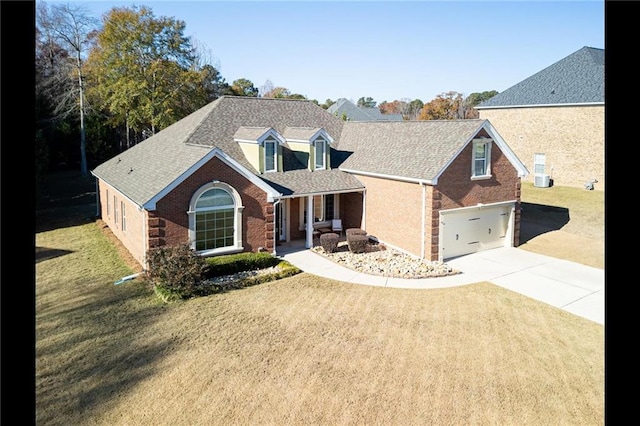 view of front of home with a garage and a front yard