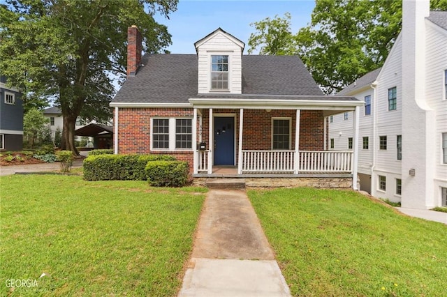 cape cod house with a porch and a front yard