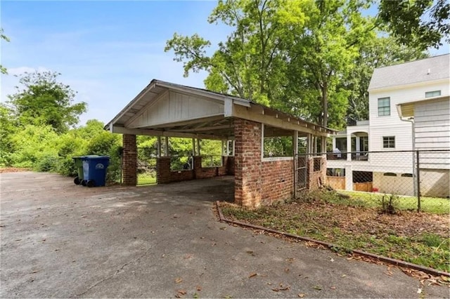 view of vehicle parking with a carport