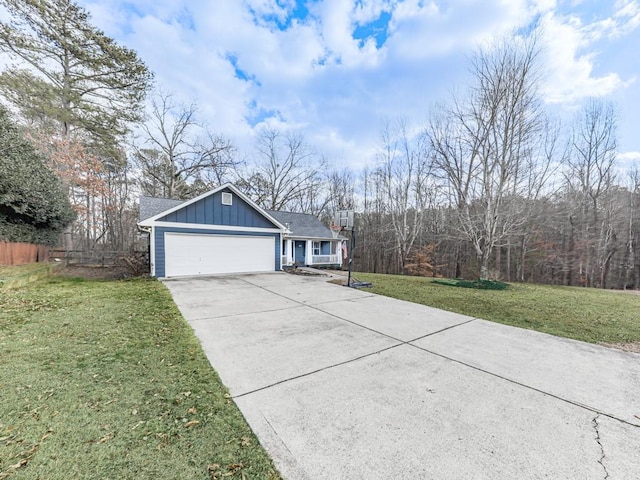 view of front of house with a garage and a front lawn