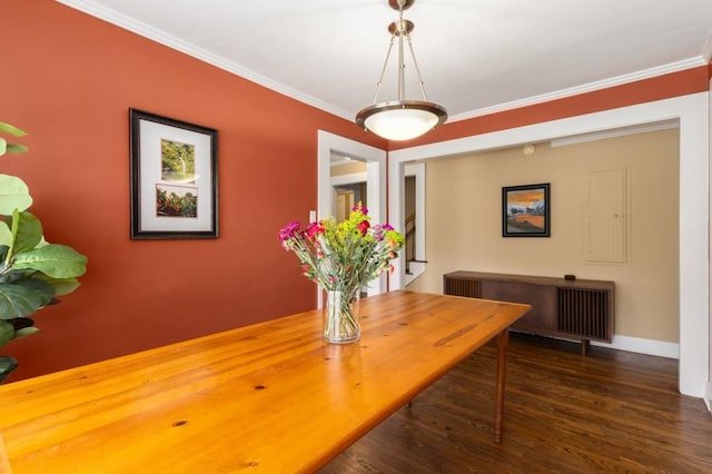 6596 Wright Rd NE, Atlanta, GA 30328 - dining space featuring wood finished floors, crown molding, and baseboards
