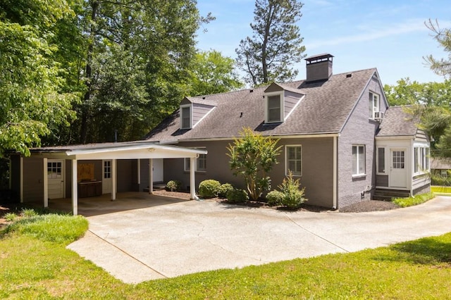 6596 Wright Rd NE, Atlanta, GA 30328 - view of front of property featuring concrete driveway, a shingled roof, a carport, and a chimney