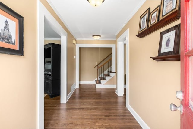 6596 Wright Rd NE, Atlanta, GA 30328 - foyer entrance with stairway, dark wood finished floors, ornamental molding, and baseboards