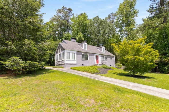 6596 Wright Rd NE, Atlanta, GA 30328 - cape cod-style house featuring a chimney and a front yard