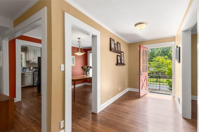 6596 Wright Rd NE, Atlanta, GA 30328 - foyer entrance with dark wood finished floors, plenty of natural light, crown molding, and baseboards