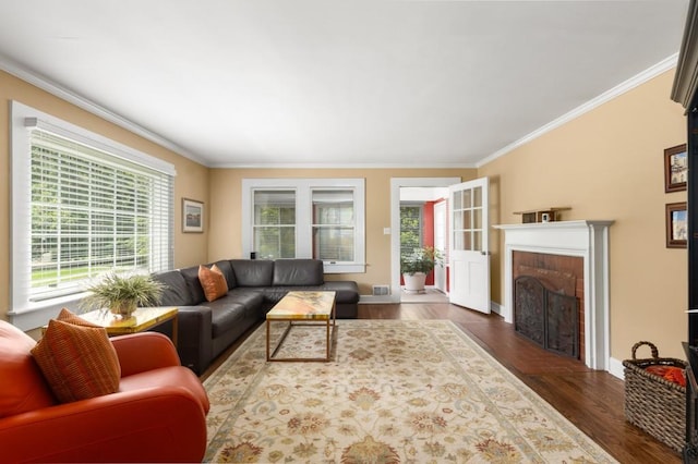 6596 Wright Rd NE, Atlanta, GA 30328 - living area featuring healthy amount of natural light, crown molding, wood finished floors, a brick fireplace, and baseboards
