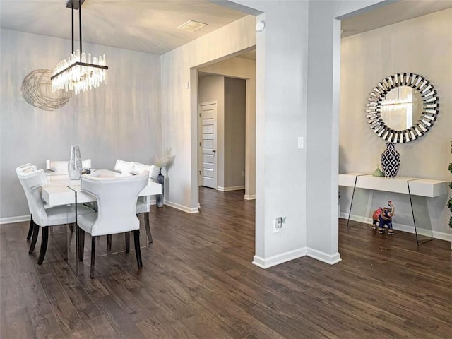 3062 Hawthorn Farm Blvd, Loganville, GA 30052 - dining room with a chandelier, wood finished floors, and baseboards